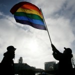 Bob Sodervick, right, waves the gay pride flag outside of City Hall in San Francisco, Tuesday, June 17, 2008. (AP Photo/Marcio Jose Sanchez)