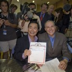 George Takei, center left, and his partner Brad Altman display their marriage certificate permit in West Hollywood, Calif. on Tuesday, June 17, 2008. The May 15 California Supreme Court ruling that overturned the state's bans on same-sex marriage became final at 5:01 p.m. Monday. (AP Photo/Hector Mata)