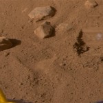 This photo provided by NASA shows the area where the Robotic Arm took a second scoop full of soil and revealed a whitish material at the bottom of the dig area informally called the "Knave of Hearts". The Robotic Arm's scraping blade left a small horizontal depression above where the sample was taken. The Science Team is debating whether this is a salt layer or the top of an ice table. The image was taken by the Surface Stereo Imager on the ninth day of the Mars mission, or Sol 9, (June 3, 2008) aboard the NASA Phoenix Mars Lander. (AP Photo/NASA/JPL-Caltech/University of Arizona/Texas A&M University)
