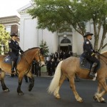 Washington D.C. mounted police ride past Holy Trinity Church in the Georgetown neighborhood of Washington Wednesday, June 18, 2008, for the funeral mass of NBC's Tim Russert, who died of a heart attack last Friday. (AP Photo/J. Scott Applewhite)
