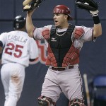 Arizona Diamondbacks catcher Miguel Montero protests a safe call as Minnesota Twins' Alexi Casilla scores on a double by Justin Morneau in third inning of a baseball game Friday, June 20, 2008 in Minneapolis. (AP Photo/Jim Mone)