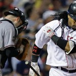 Boston Red Sox' Manny Ramirez throws his bat as Arizona Diamondbacks catcher Chris Snyder heads for the dugout after lining out with two on to end the eighth inning in their MLB baseball game at Fenway Park in Boston, Monday June 23, 2008. (AP Photo/Charles Krupa)

