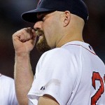 Boston Red Sox first baseman Kevin Youkilis gestures towards his eye after being struck in the face while fielding a warm up throw by teammate Mike Lowell while facing the Arizona Diamondbacks in their MLB baseball game at Fenway Park in Boston, Monday June 23, 2008. Youkilis left the game after the incident. (AP Photo/Charles Krupa)