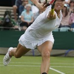 China's Jie Zheng returns to Britain's Elena Baltacha during their Women's Singles, second round match at Wimbledon, Wednesday.