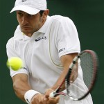 France's Florent Serra returns to Italy's Andreas Seppi during theiir Men's Singles, second round match at Wimbledon, Wednesday.