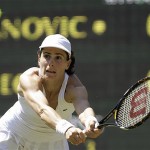 Nathalie Dechy of France reaches for a shot from Serbis's Ana Ivanovic during their Women's Singles, second round match at Wimbledon, Wednesday.  