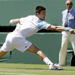 Serbia's Novak Djokovic in action during his second round match against Russia's Marat Safin on the Centre Court at Wimbledon, Wednesday.