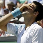 Serbia's Novak Djokovic reacts during his second round match against Russia's Marat Safin on the Centre Court at Wimbledon, Wednesday.