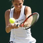Italy's Maria Elena Camerin returns to Russia's Elena Dementieva, during their Women's Singles, first round match at Wimbledon, Wednesday