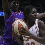 Connecticut Sun's Barbara Turner, right, looks for an opening as Phoenix Mercury's Barbara Farris guards her during the first half a WNBA basketball game in Uncasville, Conn., Sunday.