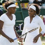 Williams sisters Serena right, and Venus in action during their doubles match against Spain's Anabel Medina Garrigues and Virginia Ruano Pascual at Wimbledon, Monday.