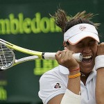 Thailand's Tamarine Tanasugarn reacts as she defeats Serbia's Jelena Jankovich, the number two seed, in their Women's Singles, fourth round match at Wimbledon, Monday.