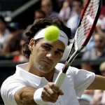 Switzerland's Roger Federer in action during his fourth round match against Australia's Lleyton Hewitt on the Centre Court at Wimbledon, Monday.