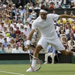Switzerland's Roger Federer in action during his fourth round match against Australia's Lleyton Hewitt on the Centre Court at Wimbledon, Monday.