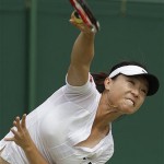 China's Zheng Jie serves to Hungary's Agnes Szavay, during their Women's Singles, fourth round match at Wimbledon, Monday.