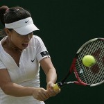 China's Zheng Jie returns to Hungary's Agnes Szavay, during their Women's Singles, fourth round match at Wimbledon, Monday.