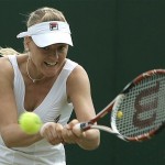 Hungary's Agnes Szavay returns to China's Zheng Jie, during their Women's Singles, fourth round match at Wimbledon, Monday.