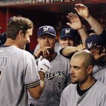 Milwaukee Brewers' J.J. Hardy (7) is congratulated by teammates in the dugout after hitting a home run against Arizona Diamondbacks in the first inning of a baseball game Tuesday.