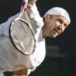 Rainer Schuettler of Germany serves to France's Arnaud Clement during their Men's Singles quarterfinal on the Centre Court at Wimbledon, Wednesday, July 2, 2008. (AP Photo/Alastair Grant)

