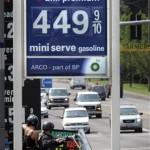 Prices are displayed at a gas station in Milwaukee, Ore., Thursday, July, 3, 2008. For the first time in a decade, AAA is predicting a drop in the number of Americans who will drive or fly 50 miles or more from home for the July Fourth holiday. (AP Photo/Don Ryan)