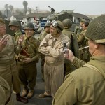 Keith Wasser, right, takes a cell phone photo of friends from the California Historical Group in period military uniforms before the annual Fourth of July parade in Huntington Beach, Calif., Friday, July 4, 2008. (AP Photo/Mark Avery)
