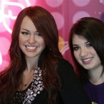 Sophie Dickson, right, a 13 year old British fan of Miley, poses with a wax figure of U.S. actress, Miley Cyrus, star of Disney Channel show Hannah Montana, unveiled at Madame Tussauds in London, Thursday, July 10, 2008. (AP Photo/Sang Tan)