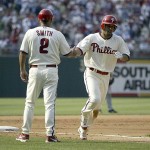 Philadelphia Phillies' Shane Victorino, right, is congratulated by third base coach Steve Smith after Victorino hit a solo home run against the Arizona Diamondbacks in the fifth inning of a baseball game Saturday, July 12, 2008, in Philadelphia. Arizona won 10-4. (AP Photo/H. Rumph Jr.)