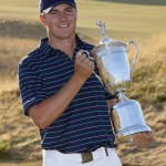 
              Jordan Spieth holds up the trophy after winning the U.S. Open golf tournament at Chambers Bay on Sunday, June 21, 2015 in University Place, Wash. (AP Photo/Matt York)
            