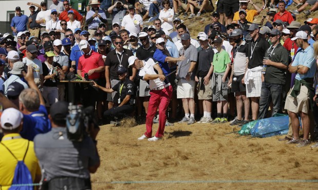 Martin Kaymer, of Germany, hits out of the crowd on the sixth hole during the second round of the U...