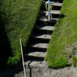 
              FILE - In this Sept. 30, 2014, file photo, the U.S. Open Championship trophy is shown on the steps of the pot bunker on the 18th fairway at Chambers Bay, the host course for the 2015 U.S. Open Championship in University Place, Wash. Mike Davis hasn't caused this much consternation since he spoke to PGA Tour players about the evils on the long putter. Only this time, he was extolling the virtues of Chambers Bay. (AP Photo/Ted S. Warren, File)
            