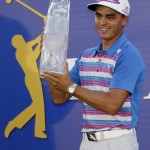 
              Rickie Fowler holds The Players Championship trophy Sunday, May 10, 2015, in Ponte Vedra Beach, Fla. Fowler won in a sudden death playoff against Kevin Kisner. (AP Photo/John Raoux)
            