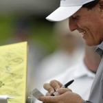 
              Phil Mickelson signs autographs during a practice round for The Memorial golf tournament, Wednesday, June 3, 2015, in Dublin, Ohio. (AP Photo/Jay LaPrete)
            
