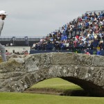 
              United States’ Dustin Johnson crosses Swilcan Bridge on hole 18 during the first round of the British Open Golf Championship at the Old Course, St. Andrews, Scotland, Thursday, July 16, 2015. (AP Photo/David J. Phillip)
            