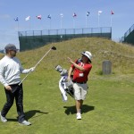 
              Ryan Moore, left, of Puyallup, Wash., hands a club to Brandon Solomonson, right, a caddie at Chambers Bay golf course, Thursday, June 11, 2015, as he walks off the 18th tee during a practice round in University Place, Wash. Moore will be competing as Chambers Bay hosts the U.S. Open Championship next week. (AP Photo/Ted S. Warren)
            