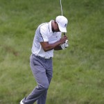 
              Tiger Woods reacts after hitting a shot on the 11th hole during the first round of the Memorial golf tournament Thursday, June 4, 2015, in Dublin, Ohio. (AP Photo/Darron Cummings)
            