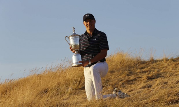 Jordan Spieth poses with the trophy after winning the U.S. Open golf tournament at Chambers Bay on ...