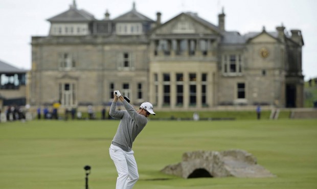 Australia’s Adam Scott drives the ball from the 18th tee during the second round of the Briti...
