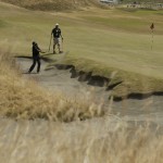 
              Byeong-Hun An, of South Korea, hits out of the bunker on the first hole during a practice round for the U.S. Open golf tournament at Chambers Bay on Monday, June 15, 2015 in University Place, Wash. (AP Photo/Ted S. Warren)
            