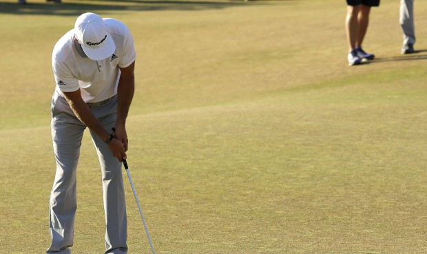 Dustin Johnson three putts the 18th hole during the final round of the U.S. Open golf tournament at...