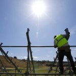 
              A worker builds a grandstand Thursday, June 11, 2015, next to a U.S. Open golf tournament practice area at Chambers Bay in University Place, Wash. The golf course will host the U.S. Open next week.  (AP Photo/Ted S. Warren)
            