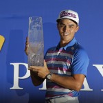 
              Rickie Fowler holds The Players Championship trophy, Sunday, May 10, 2015, in Ponte Vedra Beach, Fla. Fowler won in a sudden death playoff against Kevin Kisner. (AP Photo/Chris O'Meara)
            