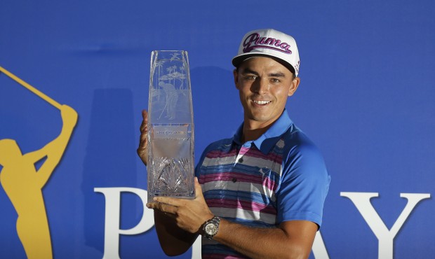 Rickie Fowler holds The Players Championship trophy, Sunday, May 10, 2015, in Ponte Vedra Beach, Fl...