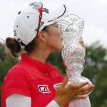 
              Chella Choi, of South Korea, kisses her trophy after winning the Marathon Classic golf tournament on the first playoff hole at Highland Meadows Golf Club in Sylvania, Ohio, Sunday, July 19, 2015. (AP Photo/Rick Osentoski)
            