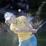 
              Brooke Pancake hits from the sand onto the 10th green during the first round of the Meijer LPGA Classic golf tournament at Blythefield Country Club, Thursday, July 23, 2015, in Belmont, Mich. (AP Photo/Carlos Osorio)
            