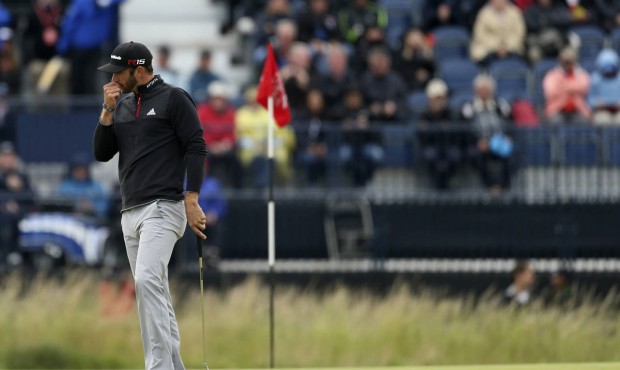 United States’ Dustin Johnson reacts on the sixth green during the third round of the British...