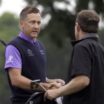
              Ian Poulter, left, shakes hands with Justin Leonard after they finished their second round of the Colonial golf tournament, Friday, May 22, 2015, in Fort Worth, Texas. (AP Photo/LM Otero)
            