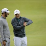 
              United States’ Jordan Spieth, right, and United States’ Dustin Johnson chat after finishing on the 18th green during the first round of the British Open Golf Championship at the Old Course, St. Andrews, Scotland, Thursday, July 16, 2015. (AP Photo/David J. Phillip)
            