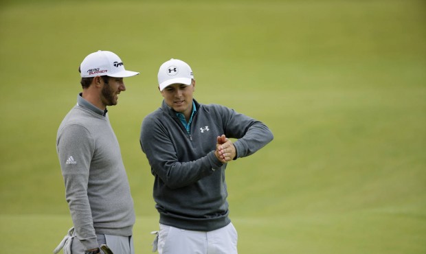 United States’ Jordan Spieth, right, and United States’ Dustin Johnson chat after finis...