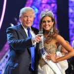 
              FILE - In this June 16, 2013, file photo, Donald Trump, left, and Miss Connecticut USA Erin Brady pose onstage after Brady won the 2013 Miss USA pageant in Las Vegas. The Reelz channel said Thursday, July 2, 2015, it will carry Trump's Miss USA pageant that was dropped by NBC after Trump made critical comments about immigrants from Mexico. (AP Photo/Jeff Bottari, File)
            