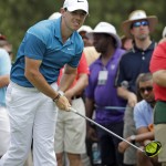 
              Rory McIlroy, of Northern Ireland, watches his tee shot on the fourth hole during the final round of the Wells Fargo Championship golf tournament at Quail Hollow Club in Charlotte, N.C., Sunday, May 17, 2015. (AP Photo/Chuck Burton)
            